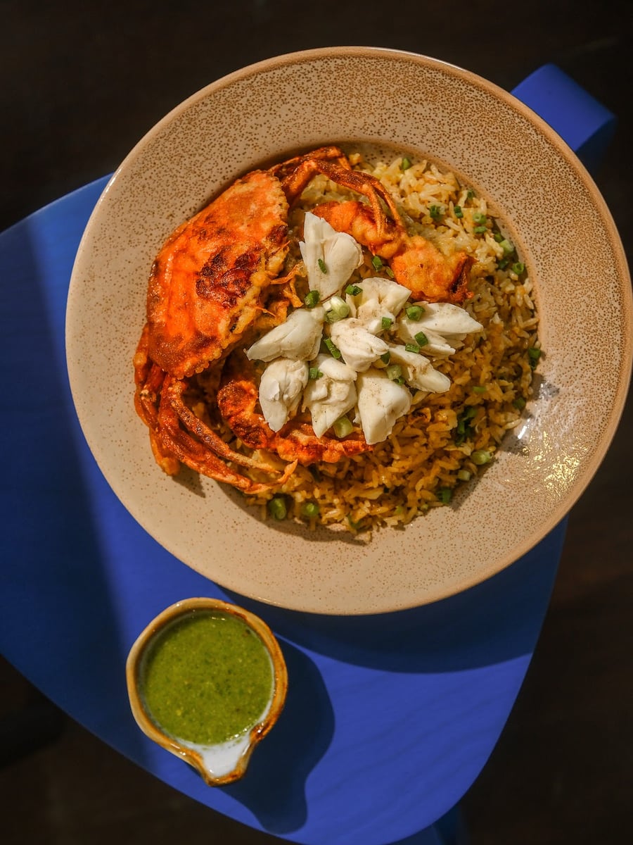 ข้าวผัดสุดดด — Sood fried rice topped with a whole soft-shell crab and lump crab meat